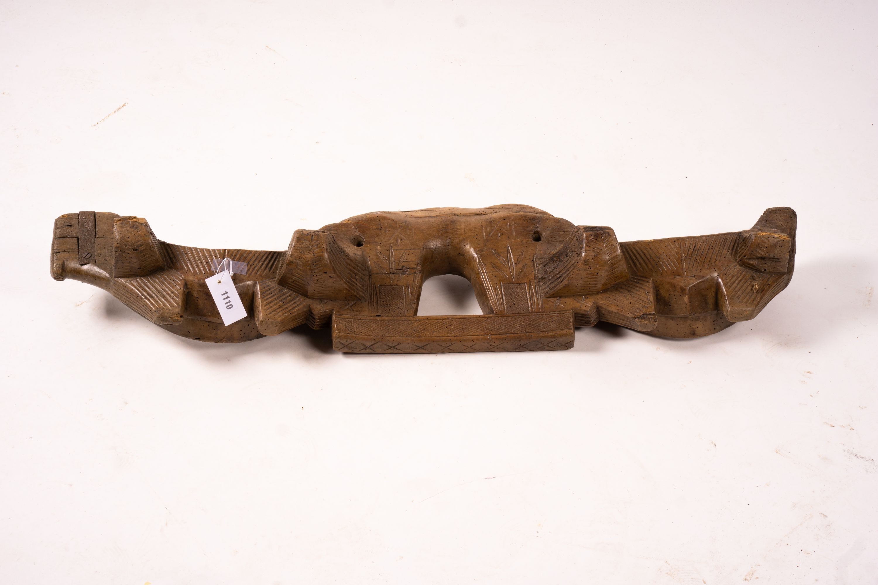 A 19th century Spanish carved fruitwood ox yoke, length 108cm